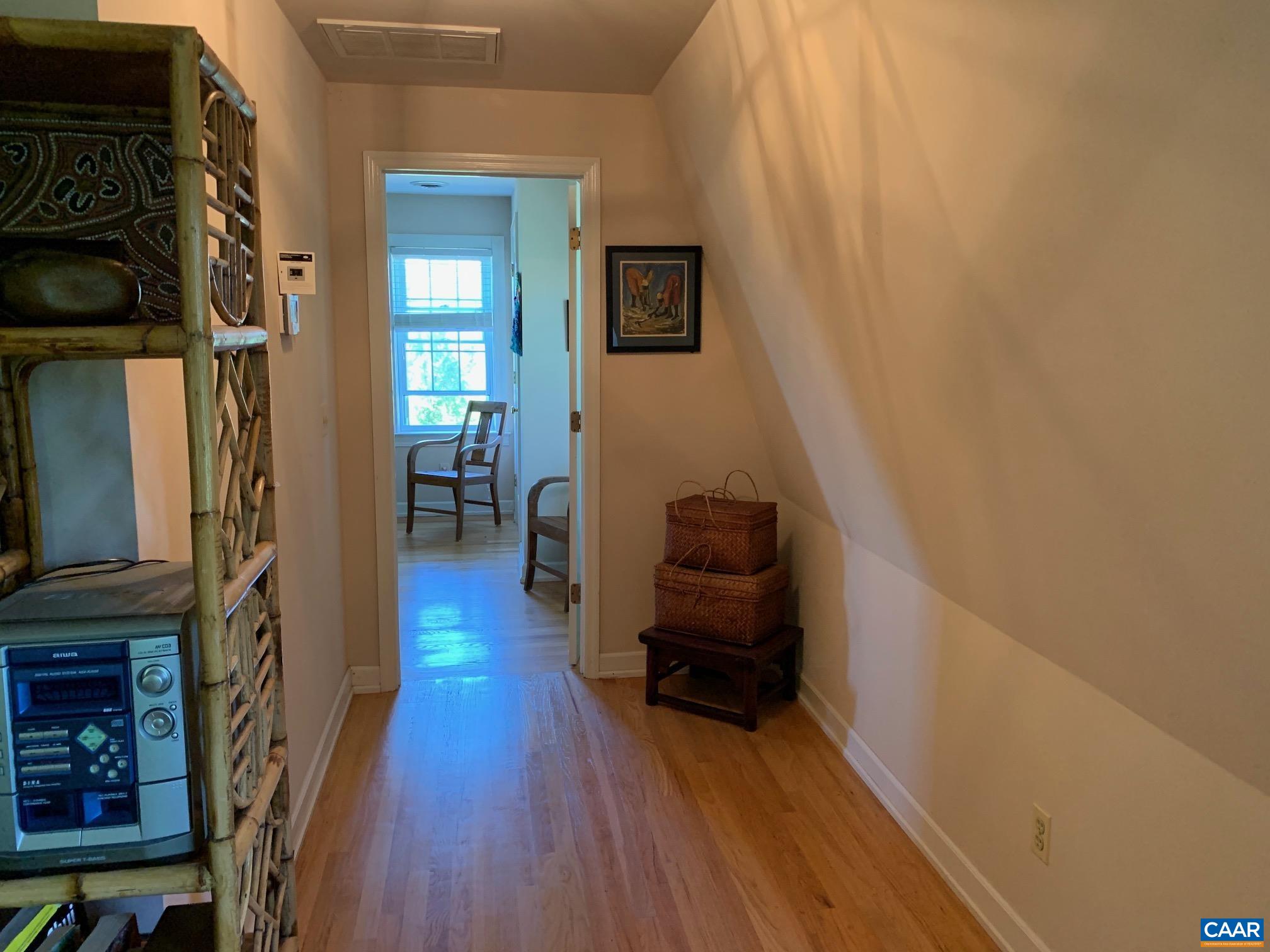 5305 Hoover Road Reva, VA 22735 - Photo 31 of 46 a view of a hallway with wooden floor and staircase