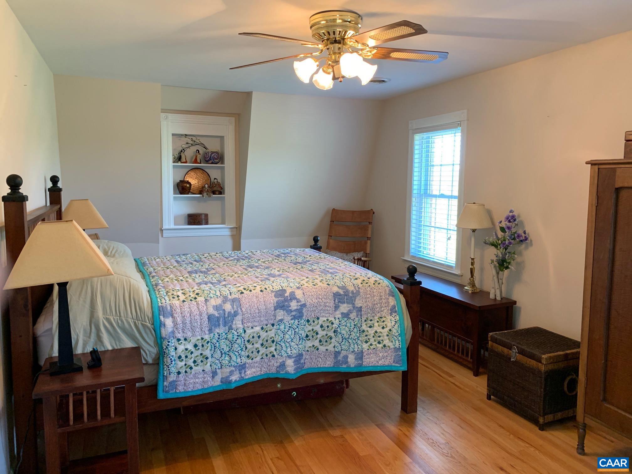 5305 Hoover Road Reva, VA 22735 - Photo 32 of 46 a bedroom with a bed and wooden floor