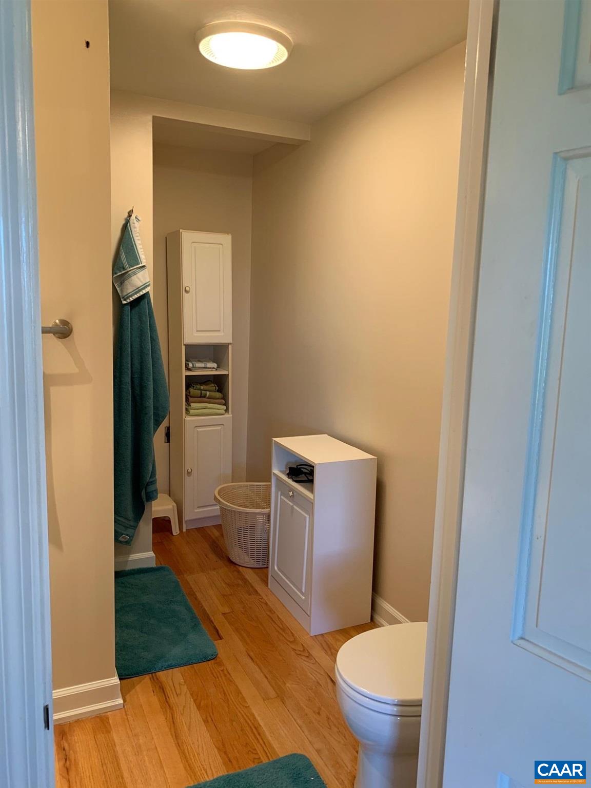 5305 Hoover Road Reva, VA 22735 - Photo 34 of 46 a bathroom with a granite countertop toilet and a sink