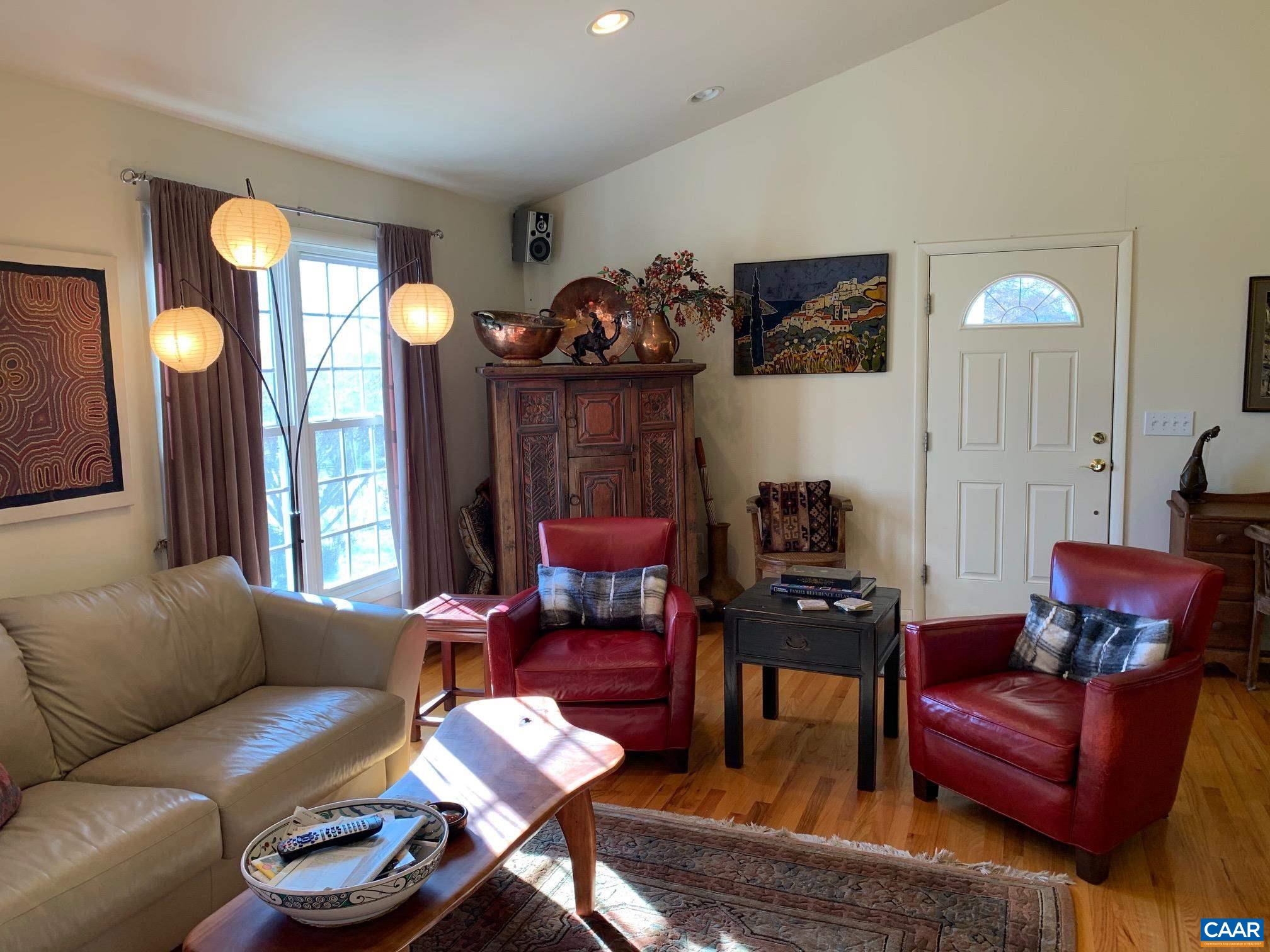 5305 Hoover Road Reva, VA 22735 - Photo 7 of 46 a living room with furniture a large mirror and a chandelier