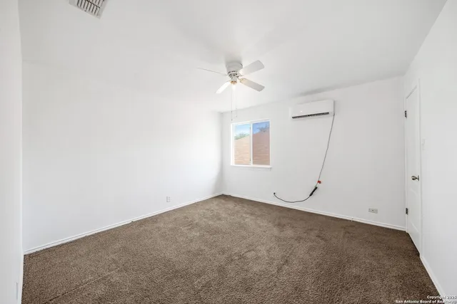 a bathroom with a sink a toilet a mirror and shower