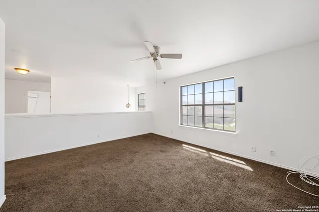 a view of a porch with wooden floor