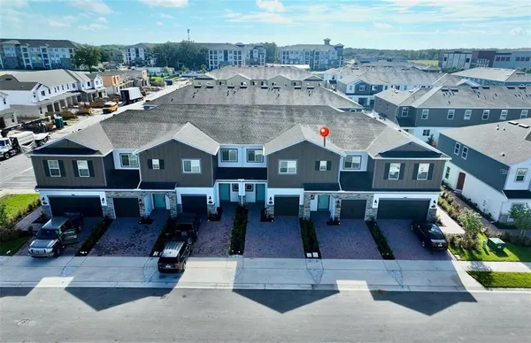 an aerial view of a house with sitting area
