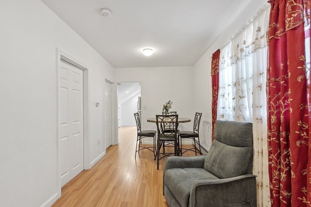 42 Perry Avenue, Unit 2 Lawrence, MA 01841 - Photo 4 of 8 a living room with furniture and a window
