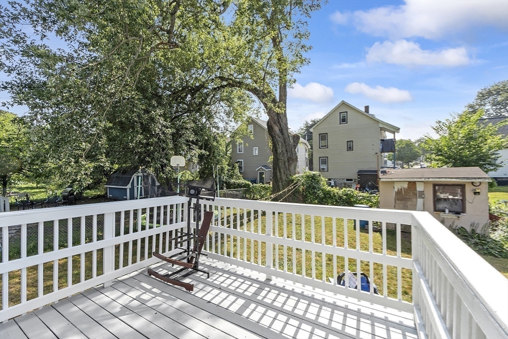 42 Perry Avenue, Unit 2 Lawrence, MA 01841 - Photo 7 of 8 a view of a wooden chairs and a table