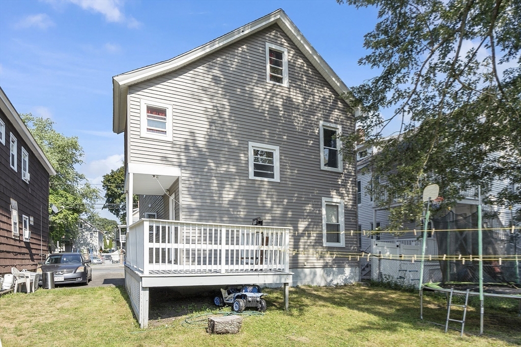 42 Perry Avenue, Unit 2 Lawrence, MA 01841 - Photo 8 of 8 a front view of a house with a yard