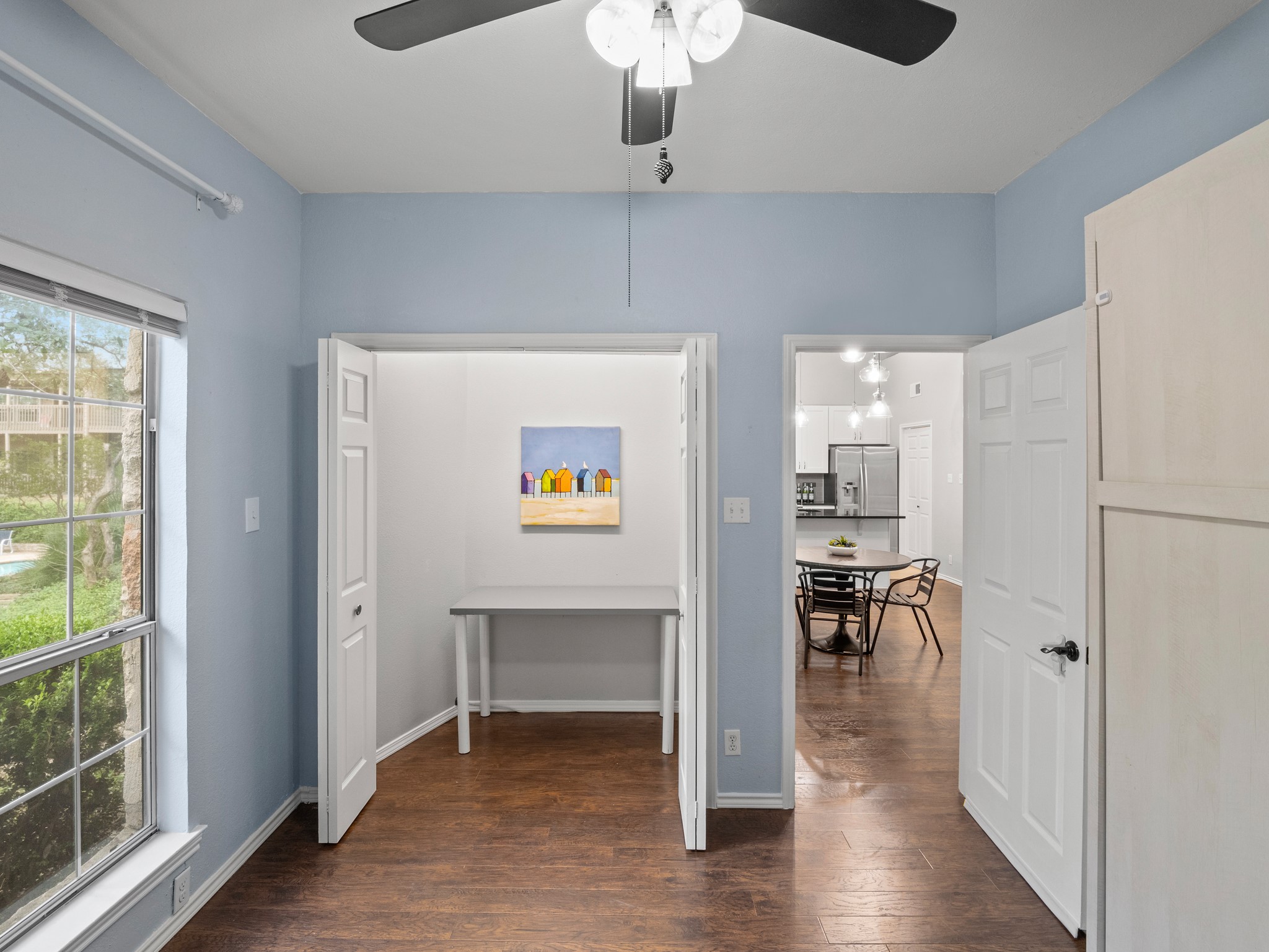 3809 Spicewood Springs Road, Unit 137 Austin, TX 78759 - Photo 16 of 34 The 3rd bedroom has a wooded view and features a Queen size Murphy Bed, plus a closet big enough to use as an office area