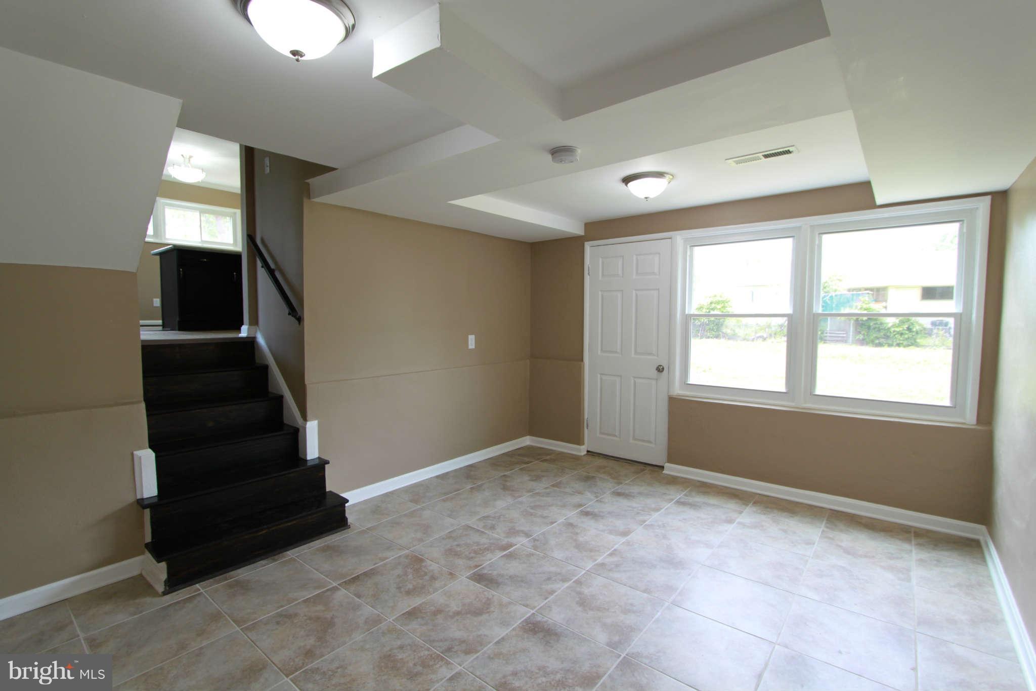 1020 Marksworth Road Baltimore, MD 21228 - Photo 22 of 30 a view of an empty room with a window