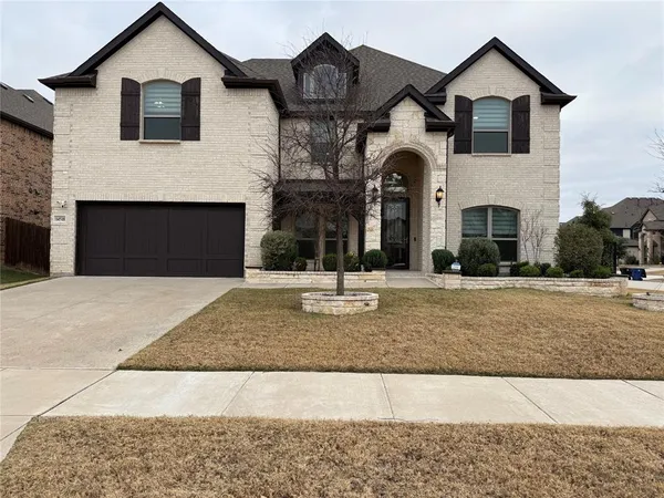 a front view of a house with yard