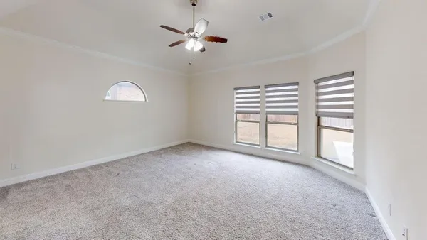 an empty room with a empty space and a ceiling fan