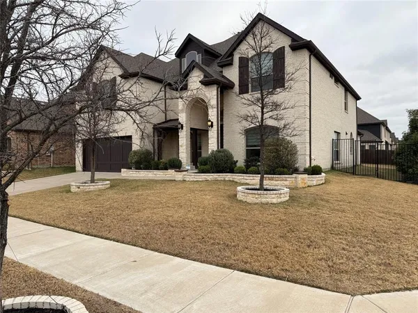 a front view of a house with garage