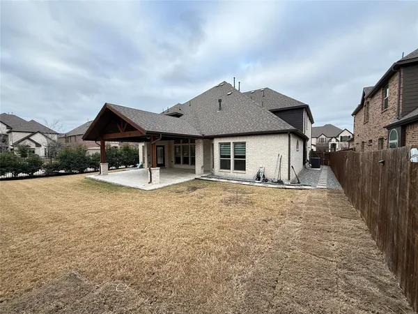 a front view of a house with yard patio and fire pit