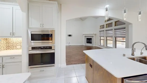 a kitchen with a sink cabinets and stainless steel appliances