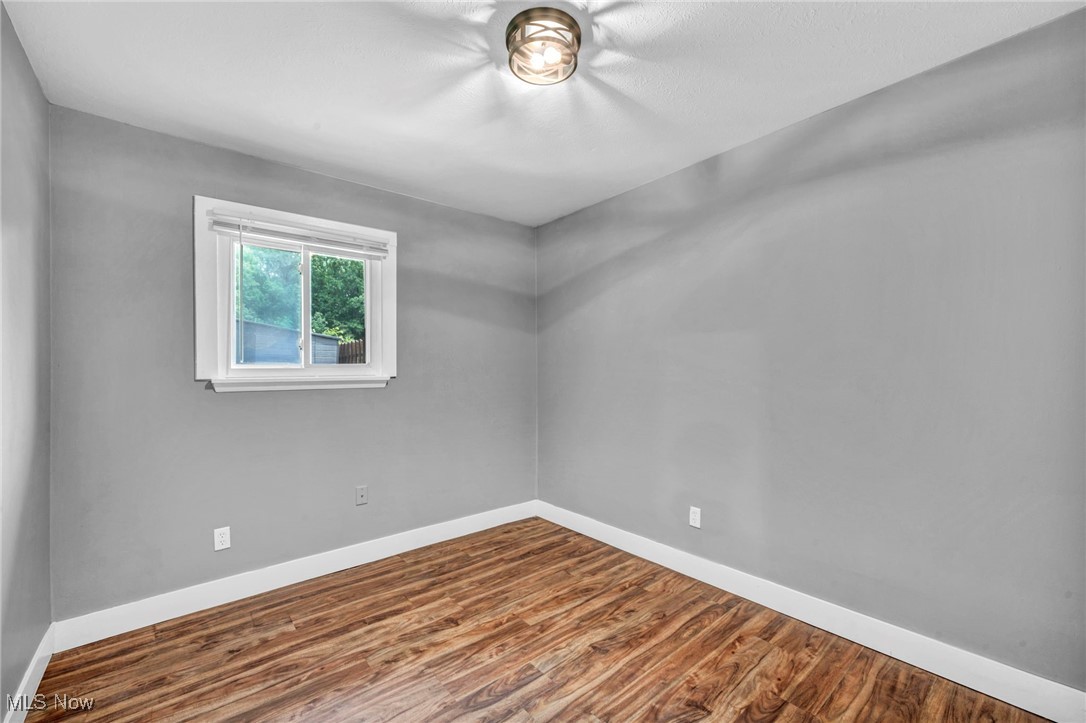 7515 Maddock Road North Ridgeville, OH 44039 - Photo 19 of 37 Unfurnished room with baseboards and wood finished floors