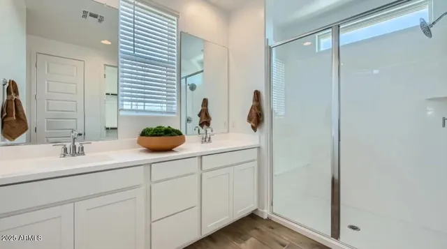 a bedroom with a bed lamp and window