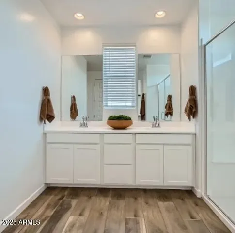 a living room with a couch and a chandelier