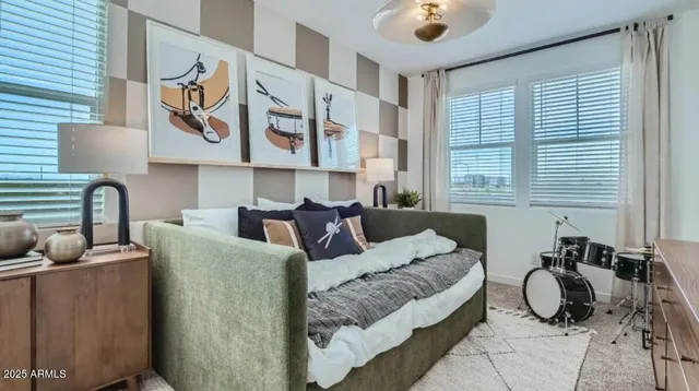 a bedroom with furniture and windows