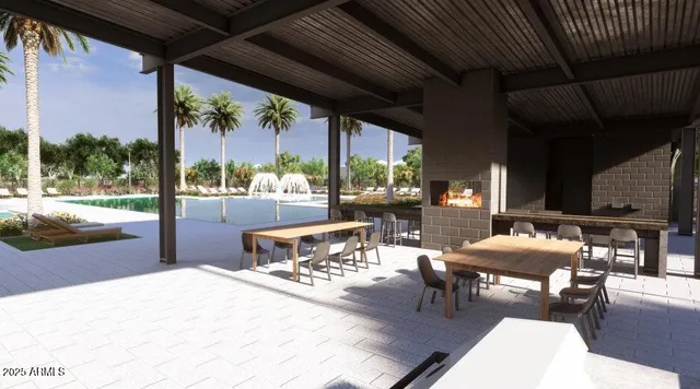 a view of a house with backyard and sitting area