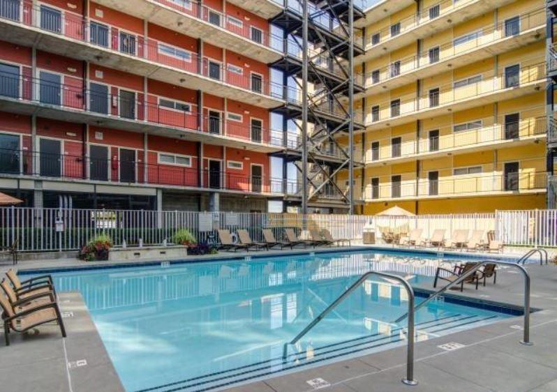 1016 Howell Mill Road, Unit 4604 Atlanta, GA 30318 - Photo 16 of 19 a front view of a building with a swimming pool