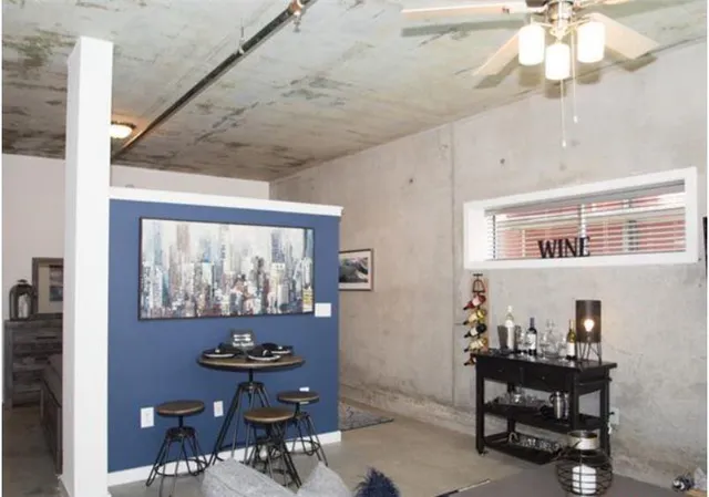 a dining room with furniture and window