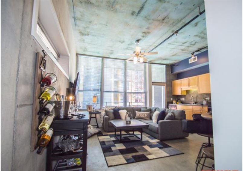 1016 Howell Mill Road, Unit 4604 Atlanta, GA 30318 - Photo 7 of 19 a living room with furniture and a flat screen tv