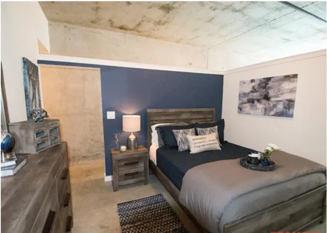 a bedroom with a bed and a couch