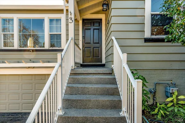 a view of a house with entrance and stairs