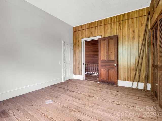a view of a room with a wooden floor
