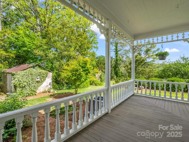 a view of a balcony with wooden floor