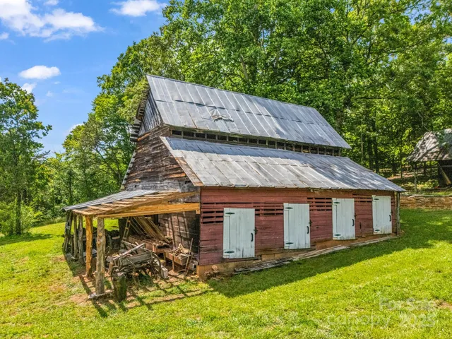 a view of a house with backyard porch and sitting area