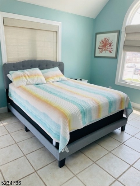 19 Haddonfield Avenue, Unit 1 Lavallette, NJ 08735 - Photo 9 of 13 a bedroom with a bed and window