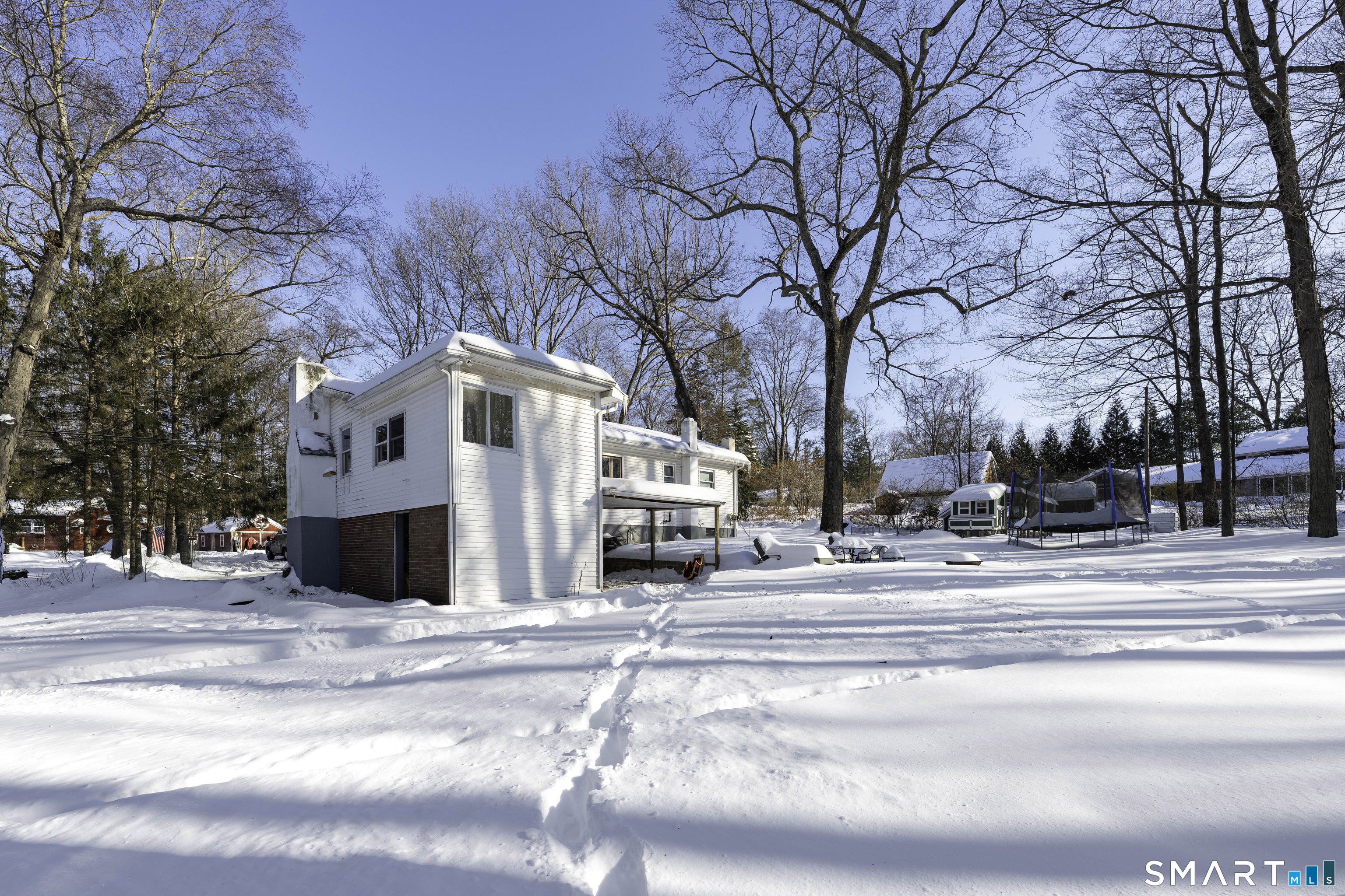 36 Maple Drive New Milford, CT 06776 - Photo 16 of 24 a view of a building with a large tree