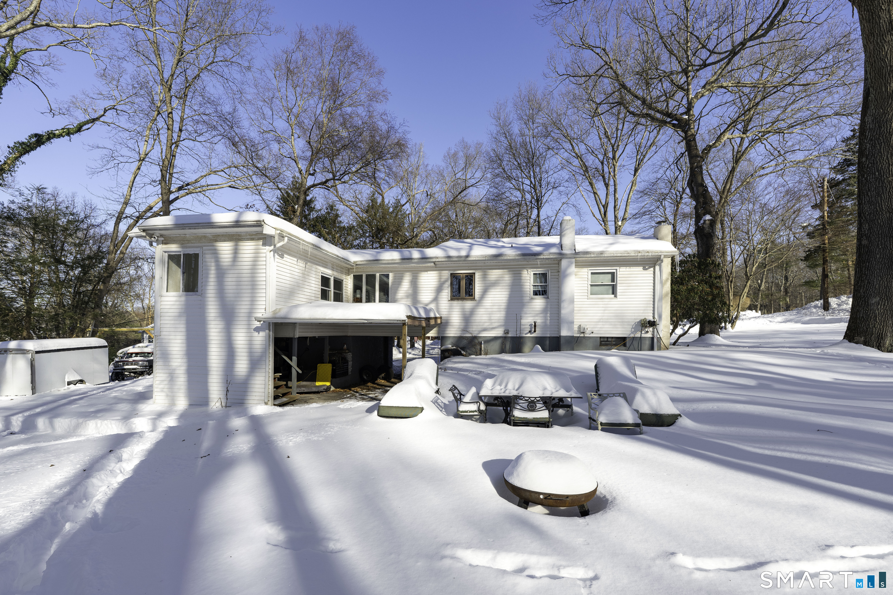 36 Maple Drive New Milford, CT 06776 - Photo 17 of 24 a view of a building with large trees