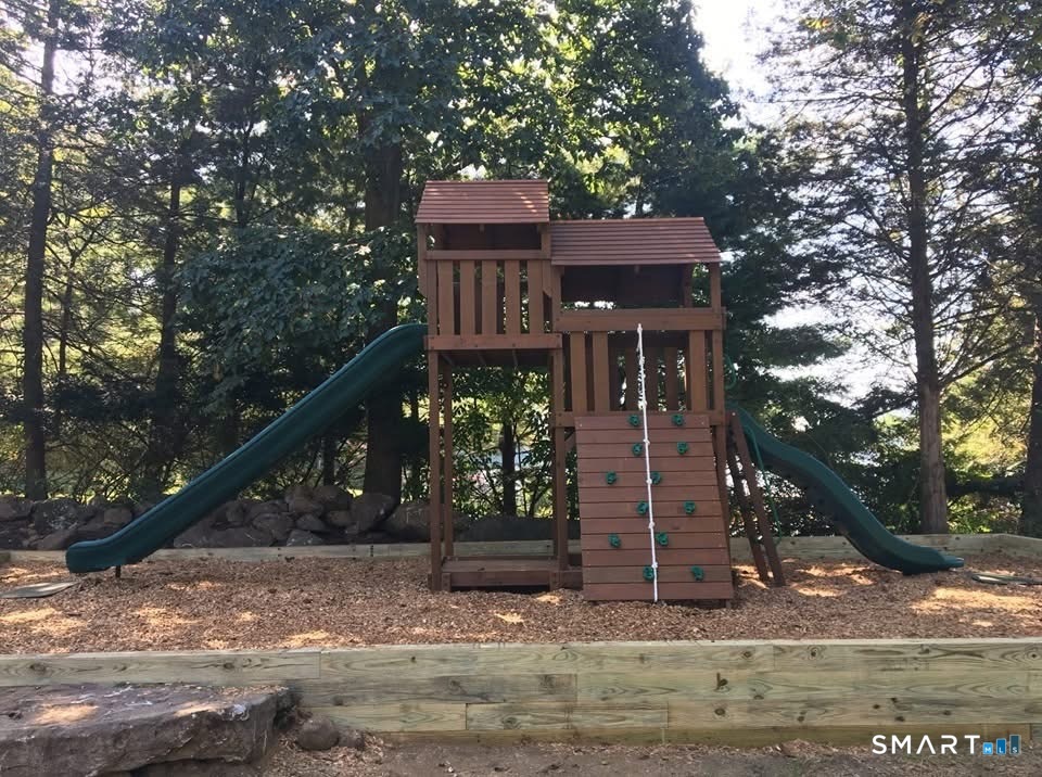 36 Maple Drive New Milford, CT 06776 - Photo 22 of 24 a front view of a house with a tree
