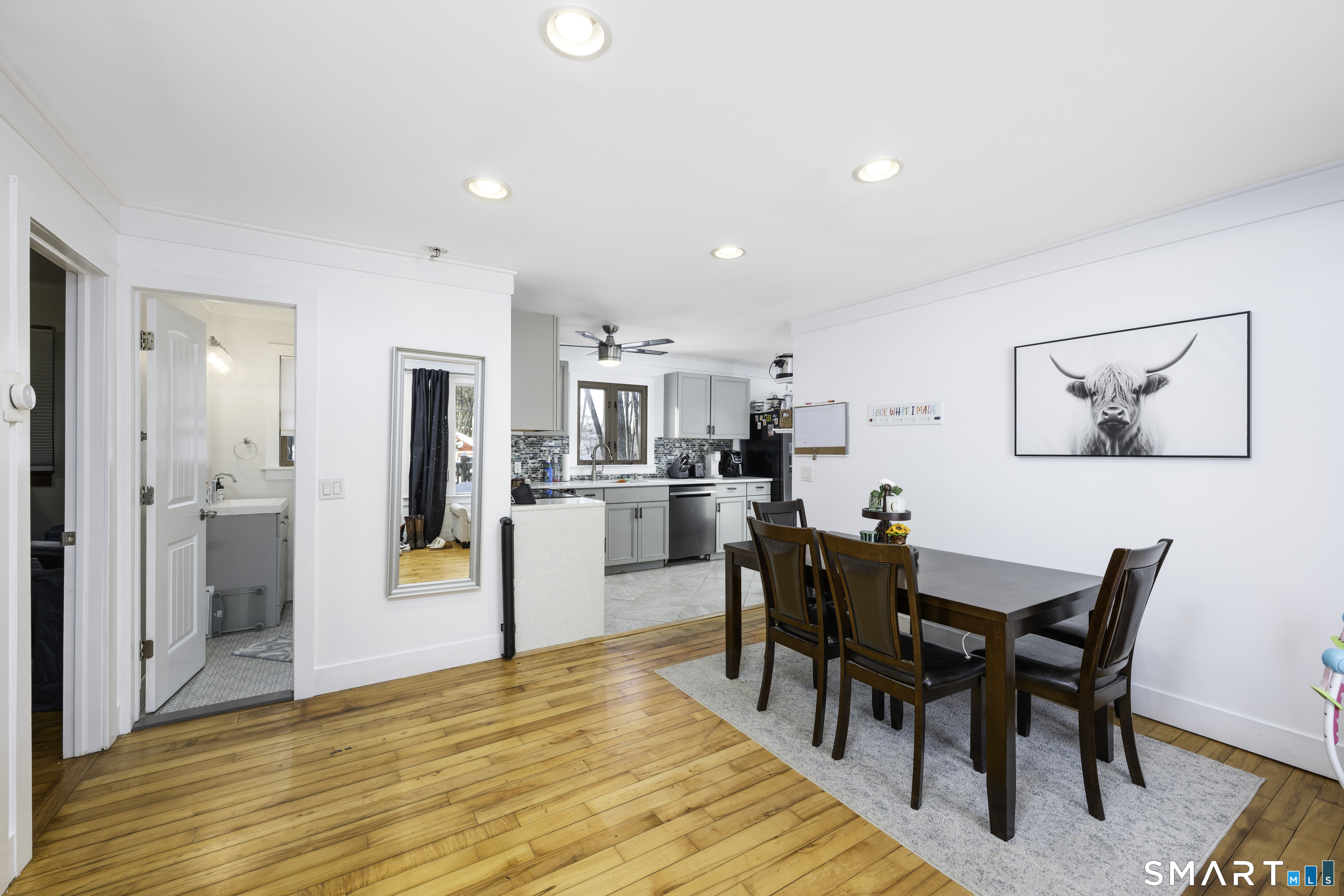 36 Maple Drive New Milford, CT 06776 - Photo 3 of 24 a view of a dining room with furniture and wooden floor