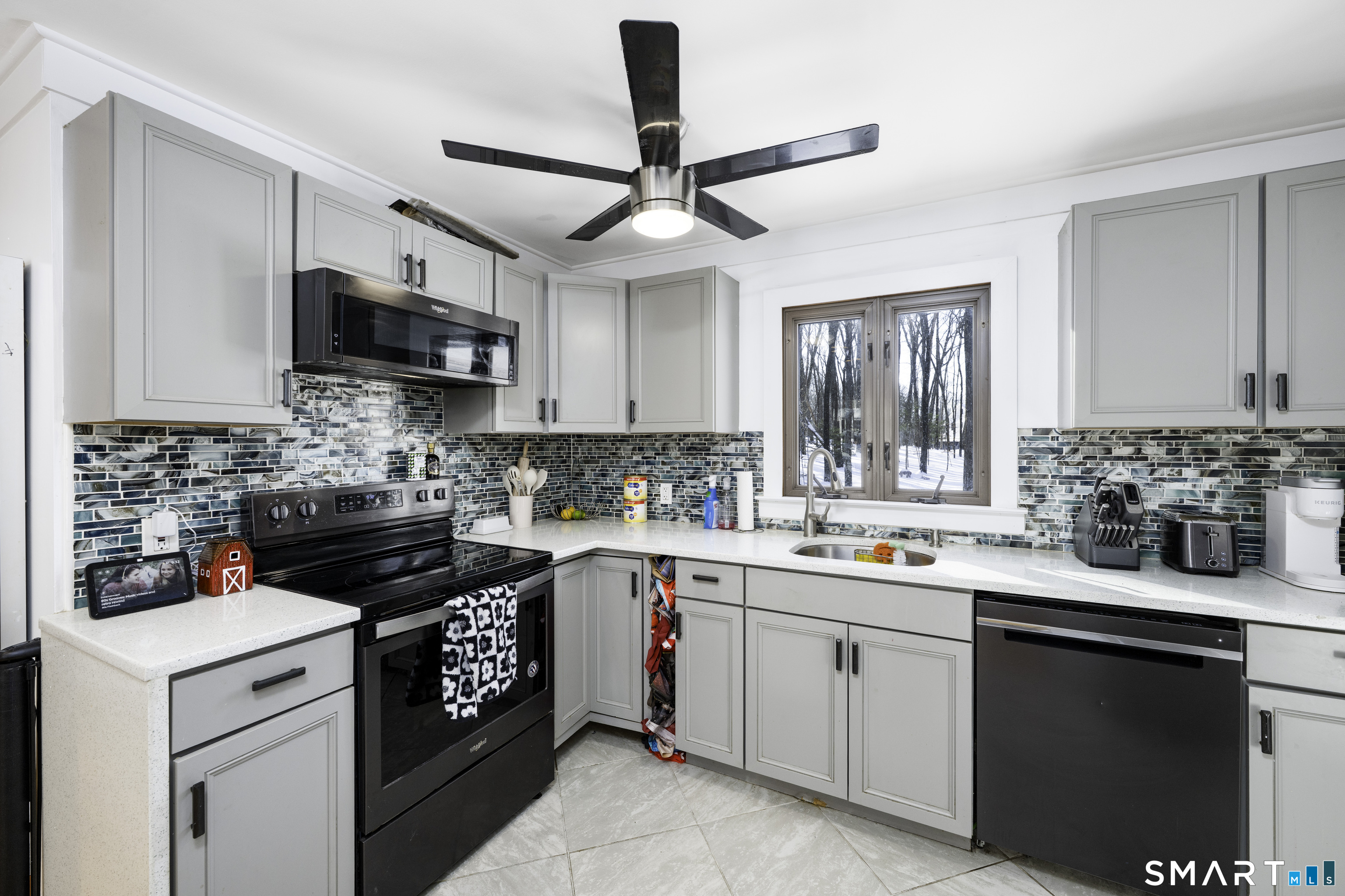 36 Maple Drive New Milford, CT 06776 - Photo 5 of 24 a kitchen with a sink stove and microwave