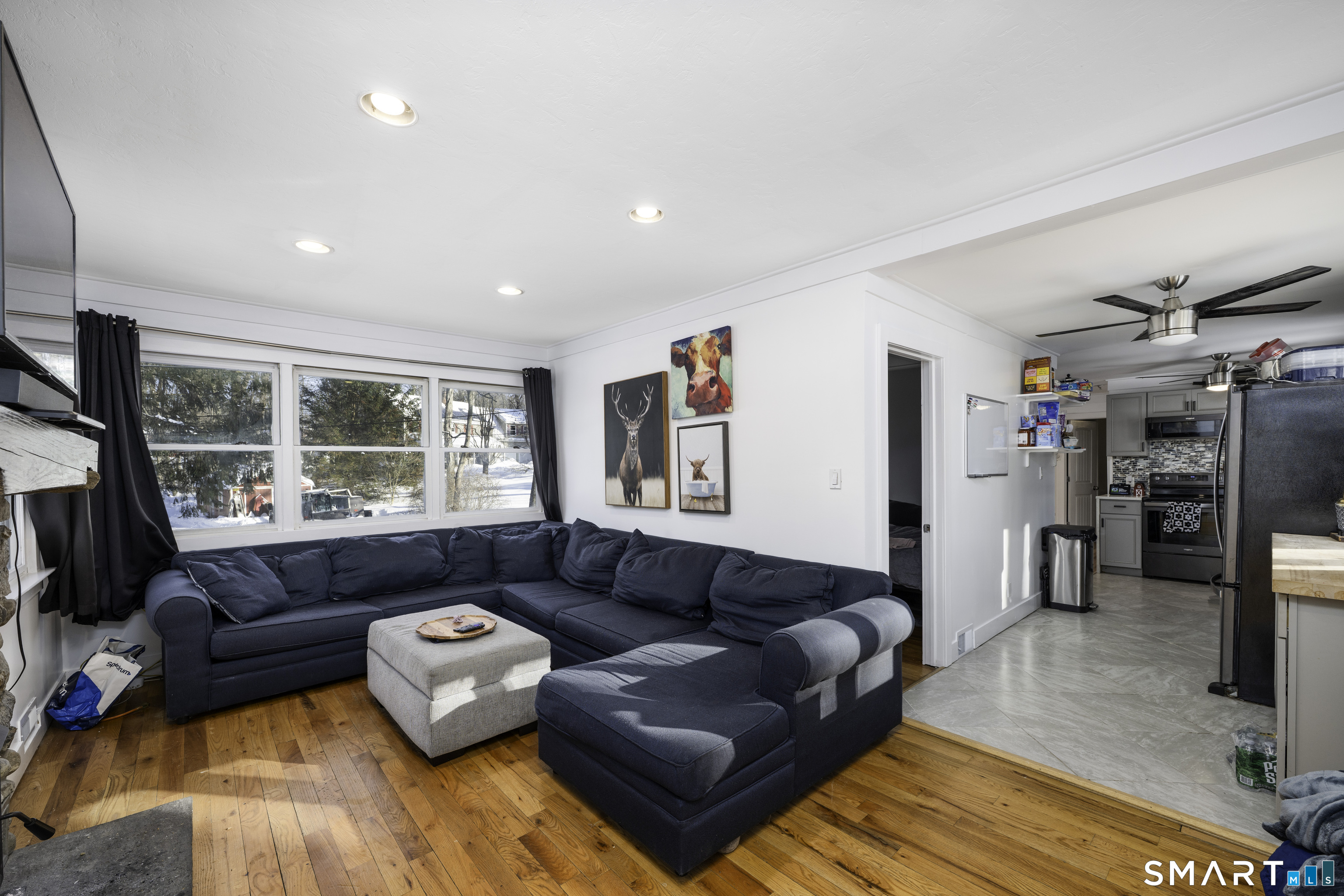 36 Maple Drive New Milford, CT 06776 - Photo 8 of 24 a living room with furniture and a large window
