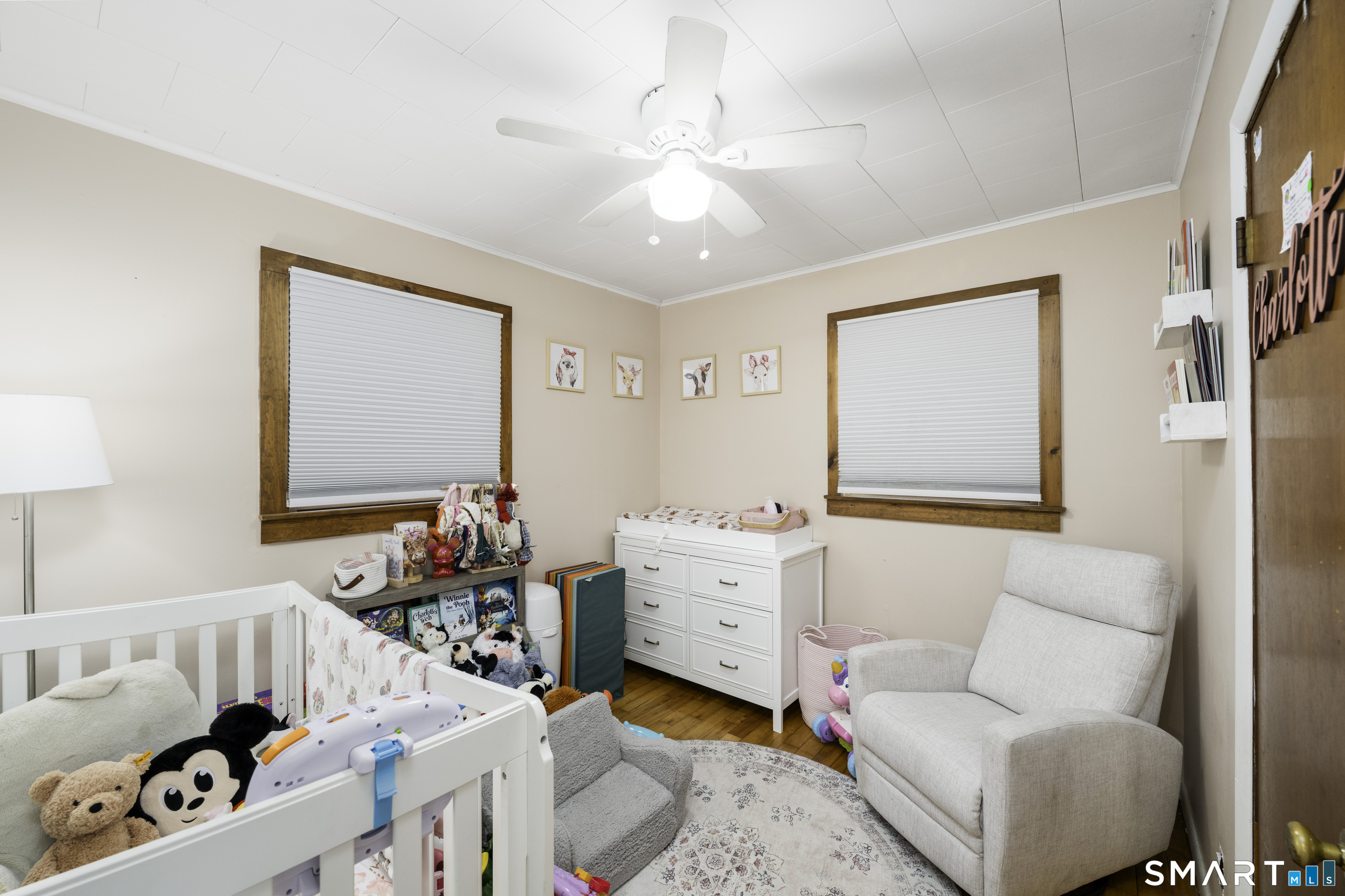 36 Maple Drive New Milford, CT 06776 - Photo 10 of 24 a living room with baby crib and dresser