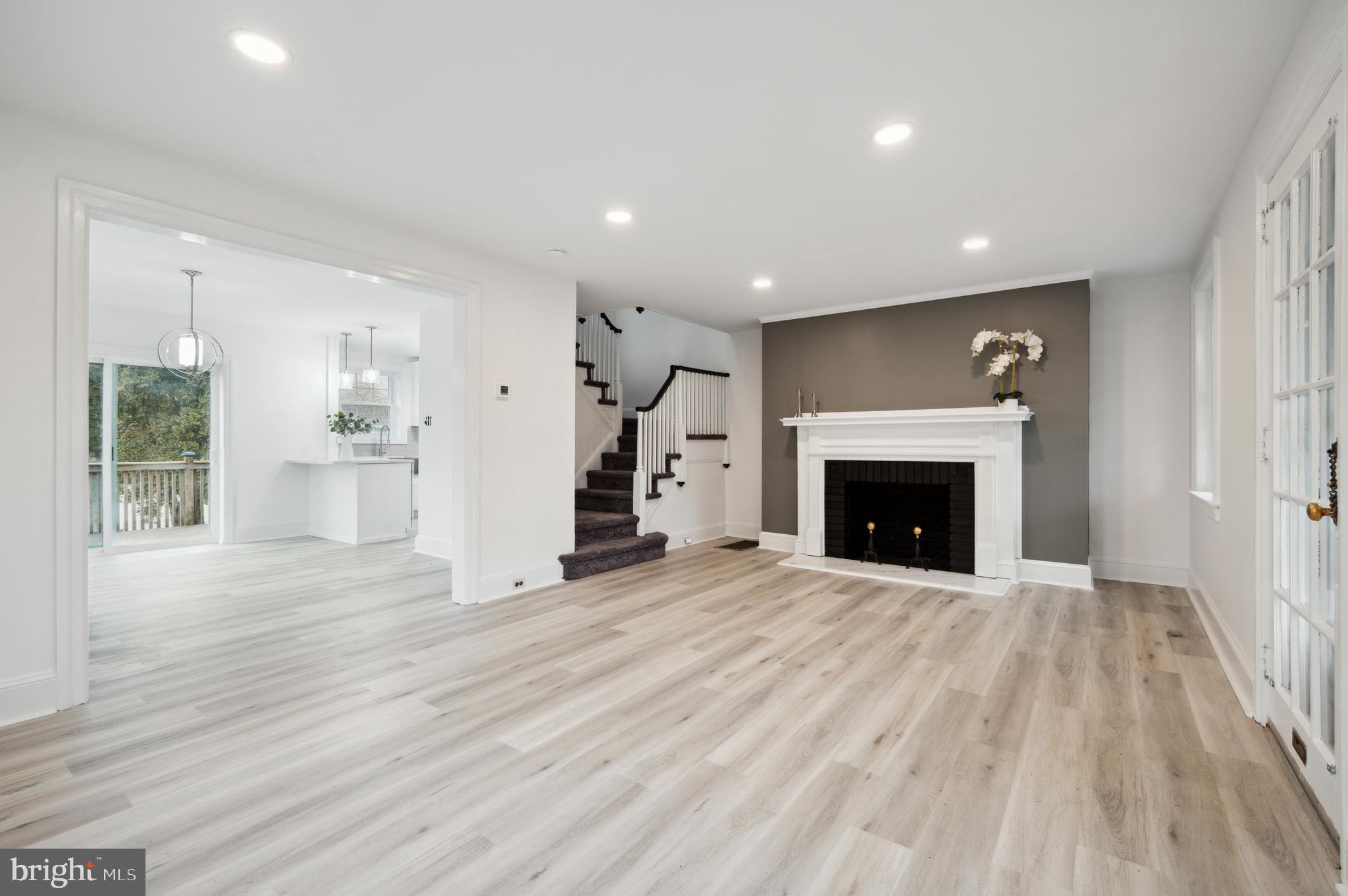 156 Edgemont Avenue Ardmore, PA 19003 - Photo 7 of 15 a view of a livingroom with a fireplace wooden floor and window