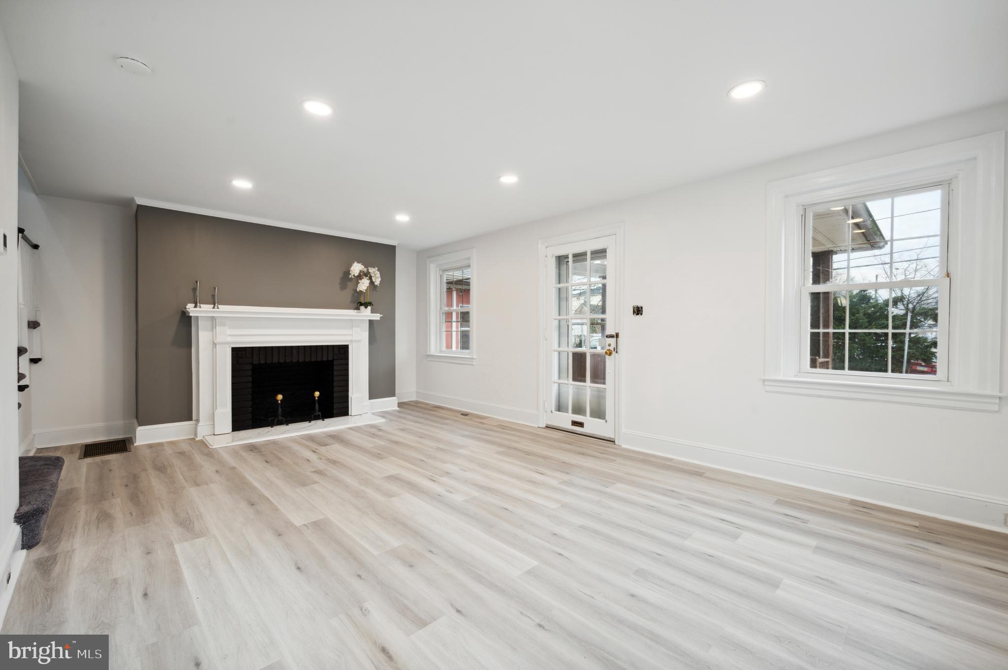 156 Edgemont Avenue Ardmore, PA 19003 - Photo 8 of 15 a view of an empty room with a fireplace and a window