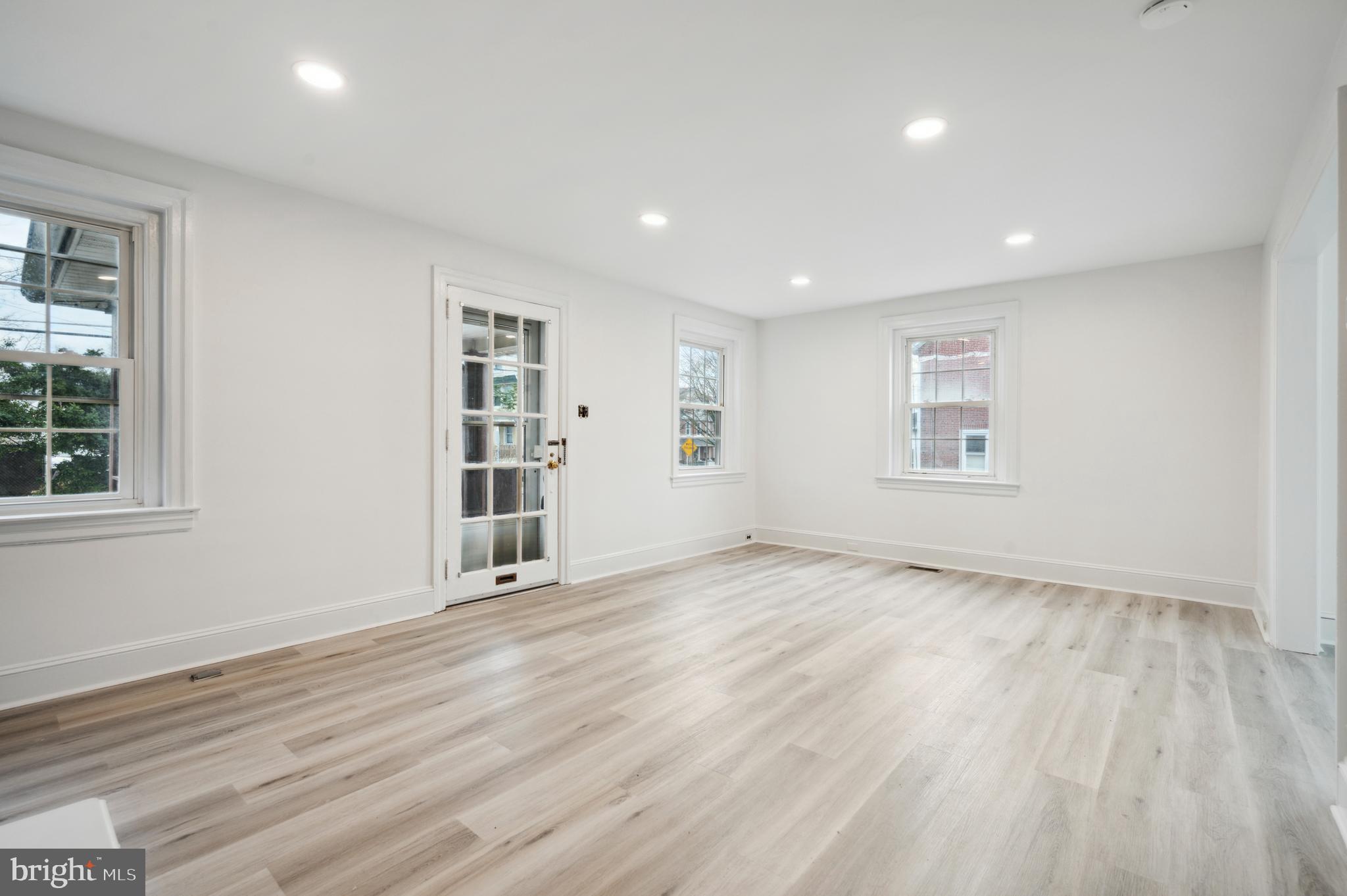 156 Edgemont Avenue Ardmore, PA 19003 - Photo 10 of 15 a view of an empty room with wooden floor and a window