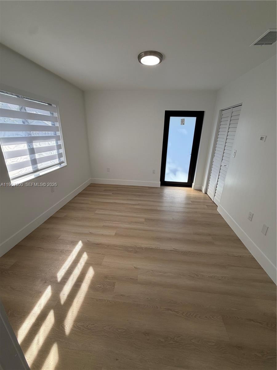 18940 Southwest 113th Court Miami, FL 33157 - Photo 19 of 30 a view of an empty room and window