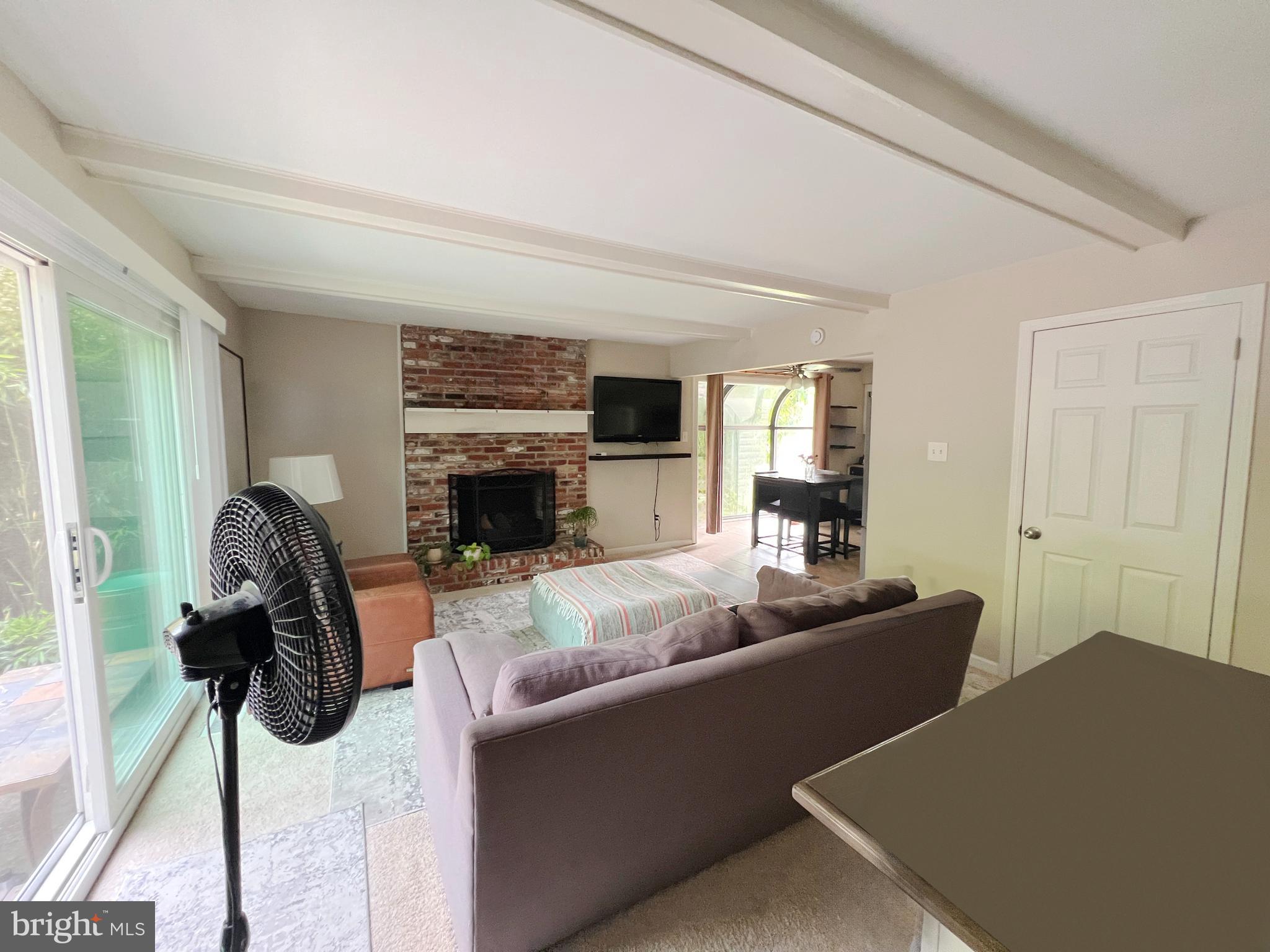 203 Spring Drive Voorhees, NJ 08043 - Photo 14 of 21 a living room with furniture and a fireplace