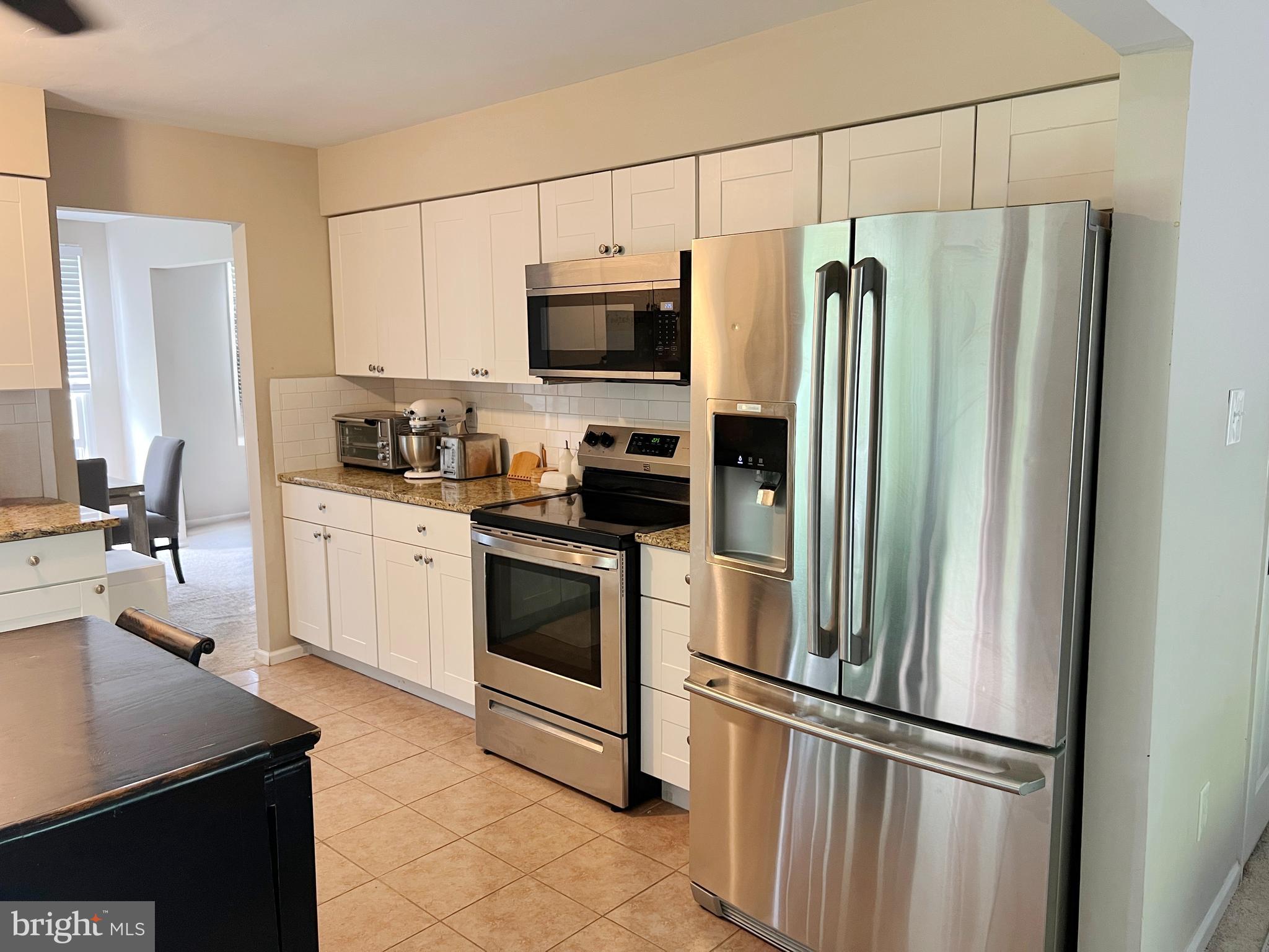 203 Spring Drive Voorhees, NJ 08043 - Photo 17 of 21 a kitchen with stainless steel appliances a refrigerator sink and microwave
