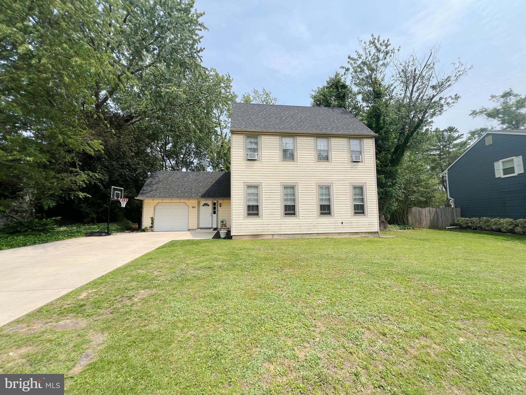 203 Spring Drive Voorhees, NJ 08043 - Photo 2 of 21 front view of a house with a yard