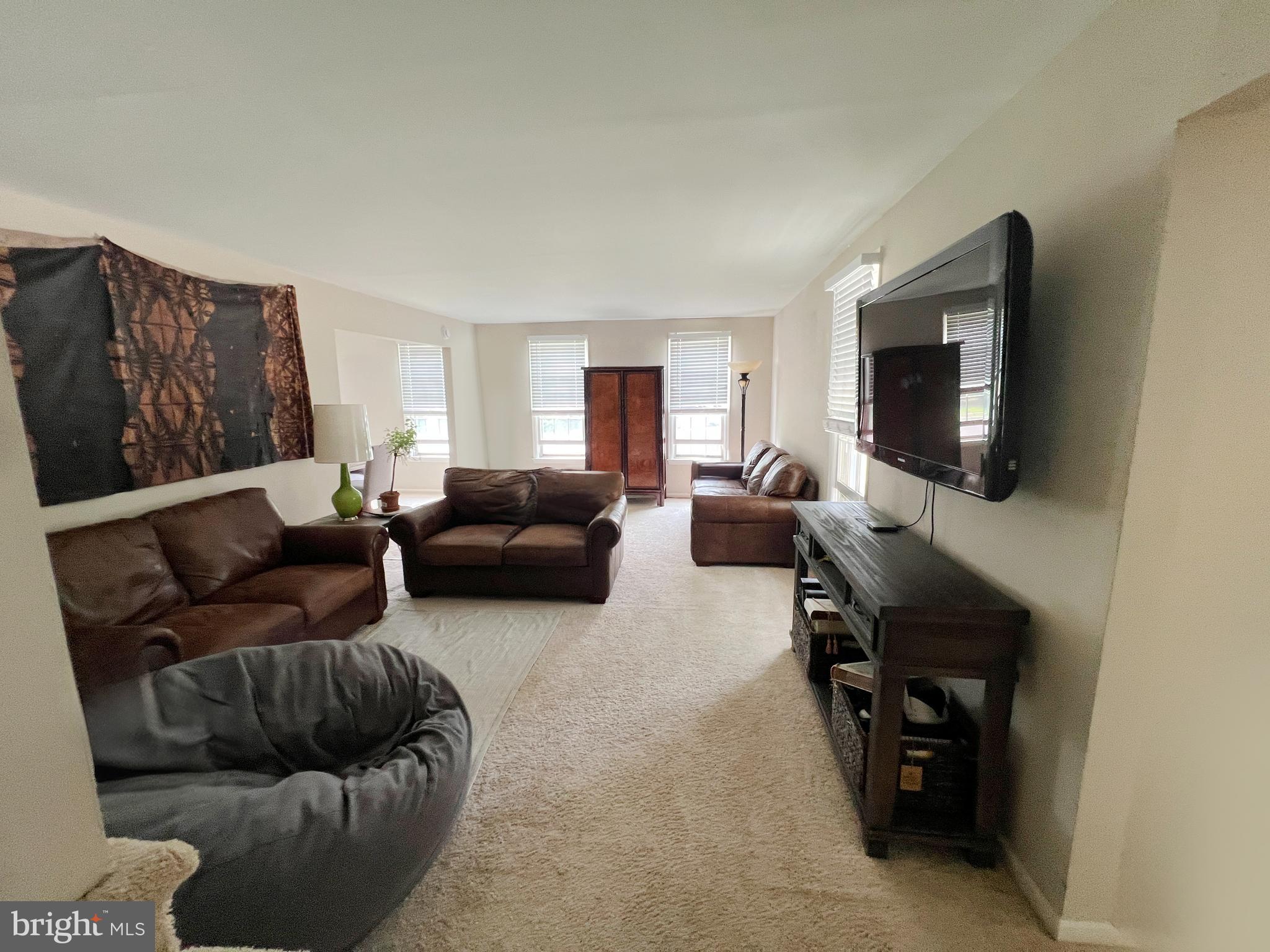 203 Spring Drive Voorhees, NJ 08043 - Photo 3 of 21 a living room with furniture and a flat screen tv