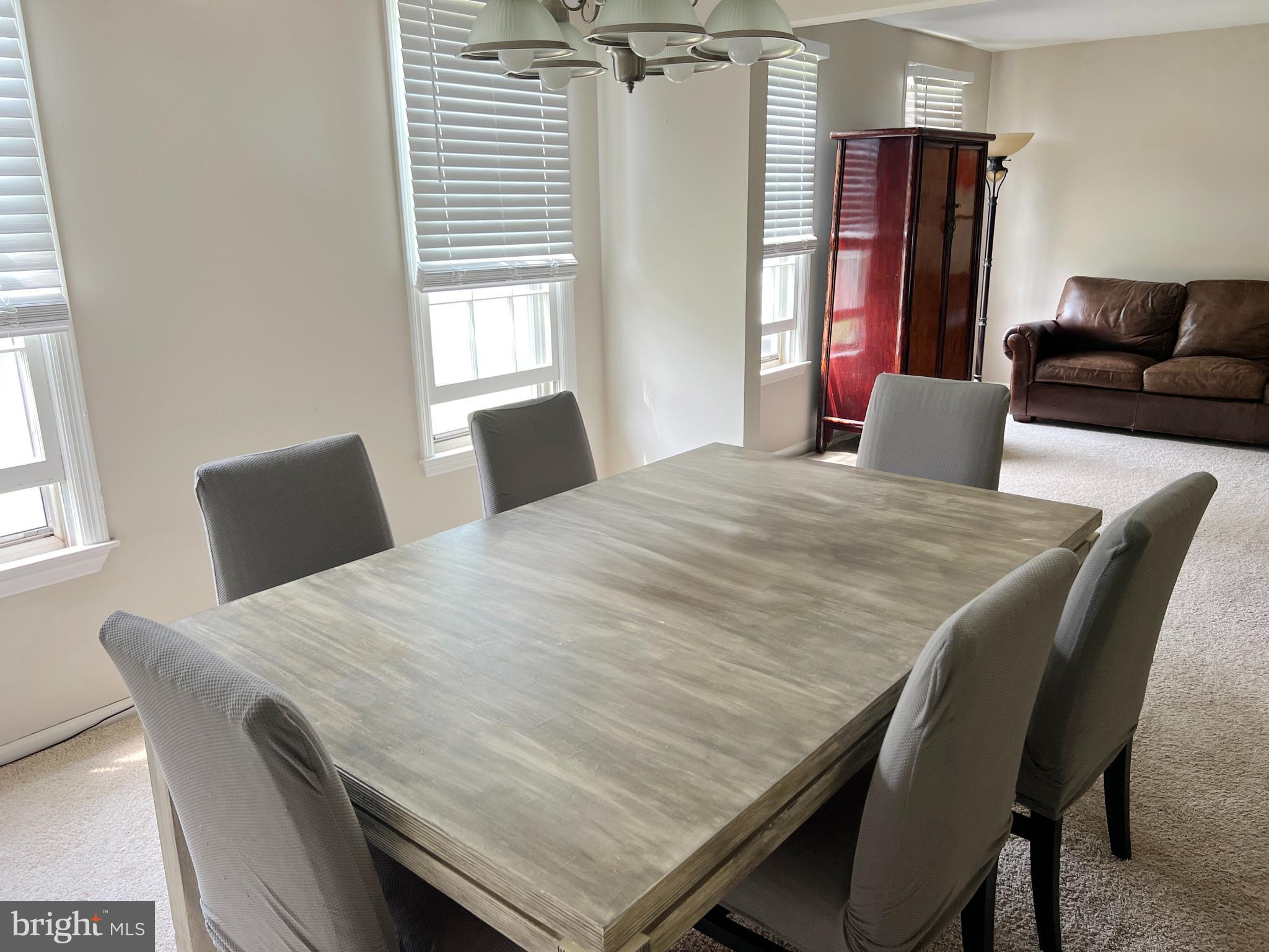 203 Spring Drive Voorhees, NJ 08043 - Photo 8 of 21 a dining room with furniture and window