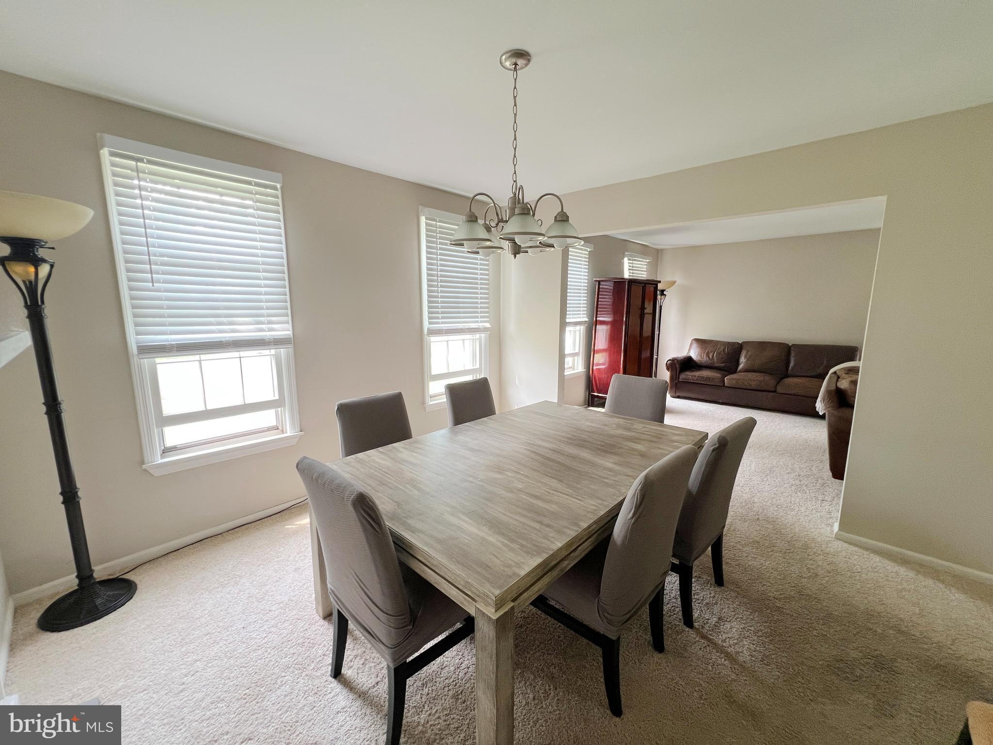 203 Spring Drive Voorhees, NJ 08043 - Photo 9 of 21 a view of a dining room with furniture and window