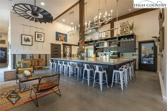 a kitchen that has a stove and a table