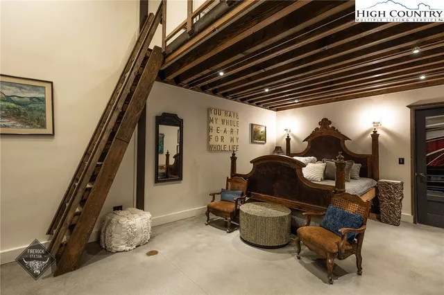 a room with furniture and gym equipment